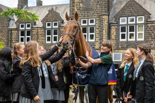 Sigurd greeting students at Ilkley Grammar School, West Yorkshire.jpg